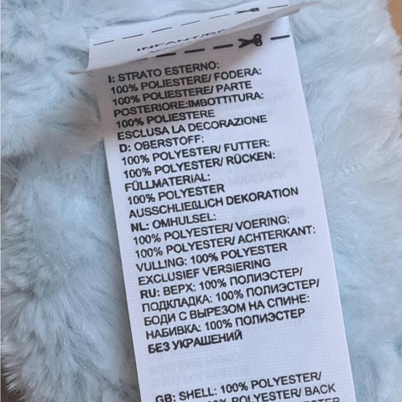 The North Face Littles Mossbud Swirl reversible mittens in a light blue color - Picture 7 of 10